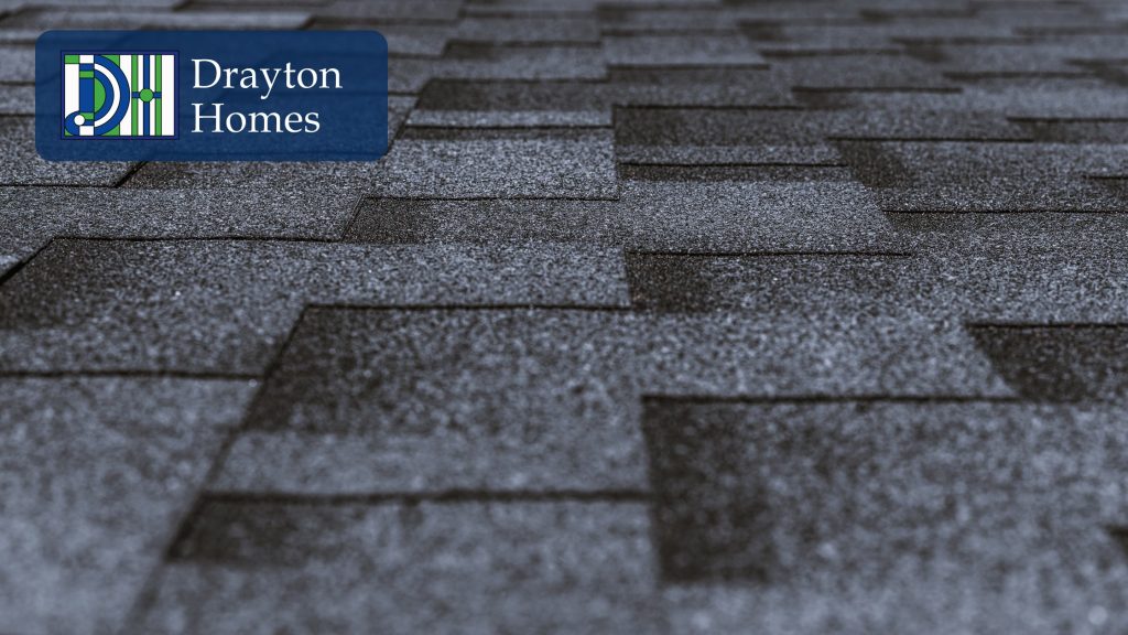 Close-up of finished gray asphalt roof shingles